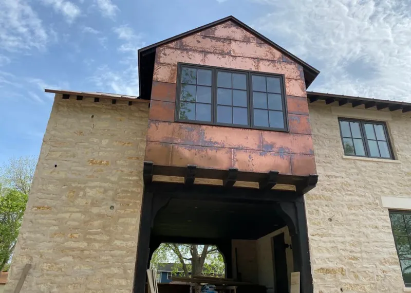 Copper metal panel facade on a stone building for Skylight Installation in Maidencreek