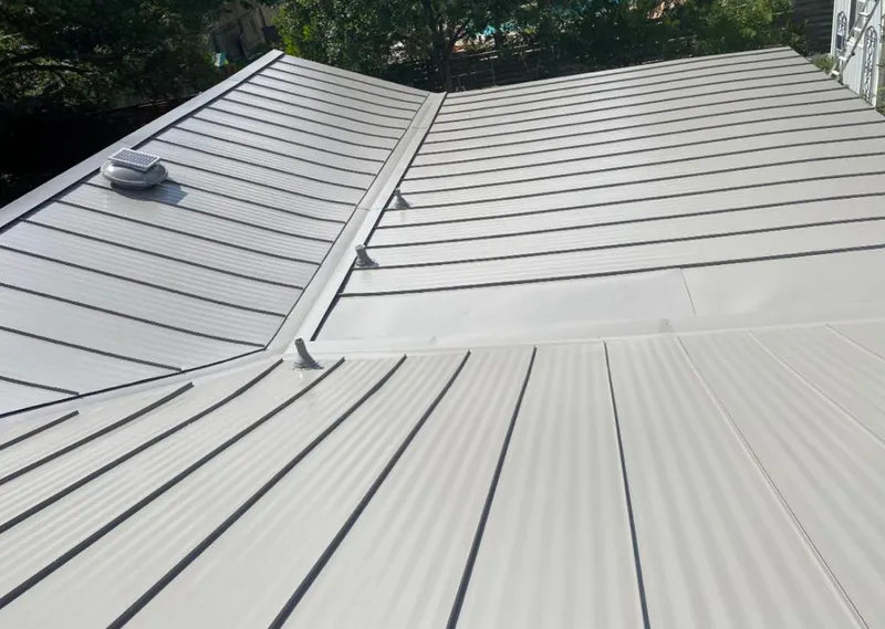 Solar attic fan installed on a metal roof for Roof Ventilation in Maidencreek